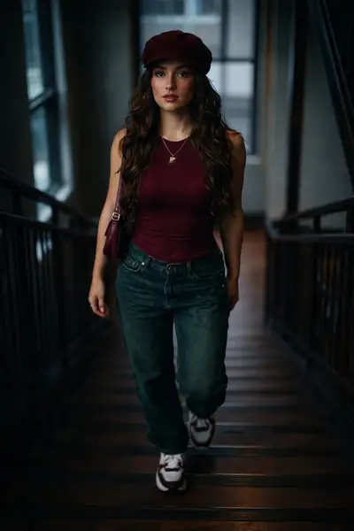Cinematic Fashion Portrait of Young Woman on Staircase