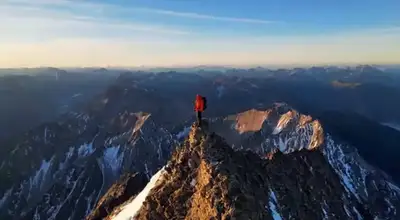 Cinematic Aerial Orbit of Mountain Climber