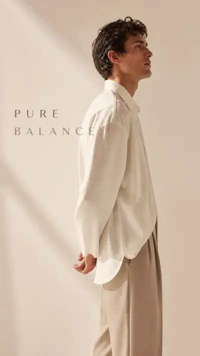 Minimalist fashion campaign, model in ivory shirt and beige trousers