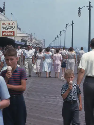 1950s seaside boardwalk family photo in Kodachrome style