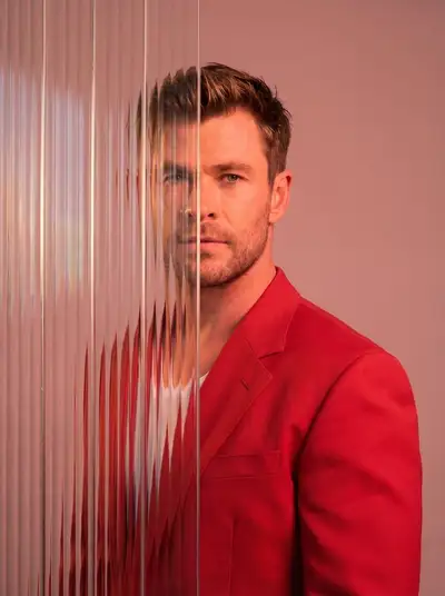 Editorial portrait distorted behind ribbed glass panels