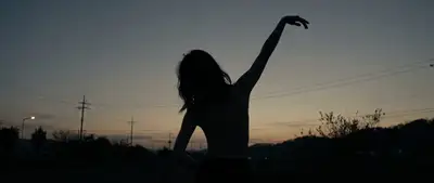 Cinematic Film Still: Silhouetted Dancer at Dusk