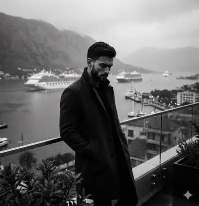 Moody black-and-white portrait of a man on a foggy balcony