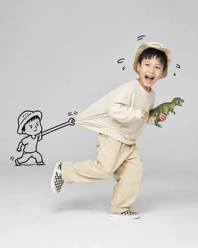 Playful studio portrait with a doodle stick figure grabbing a shirt