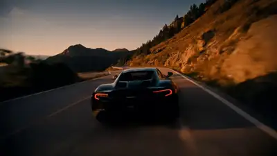 Cinematic sports car mountain road