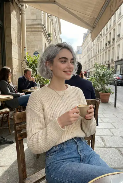 Candid lifestyle portrait at a Parisian street cafe
