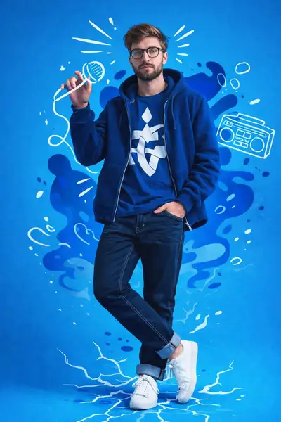 Full-body streetwear portrait with white doodle graphics
