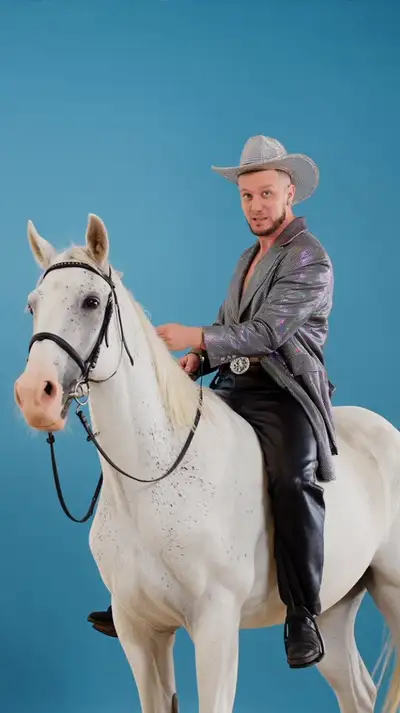Glamorous Androgynous Model on White Horse