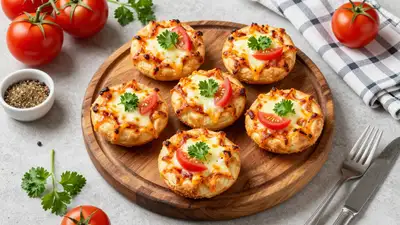 Top-down food photo of golden mini pizza bites on a wooden board