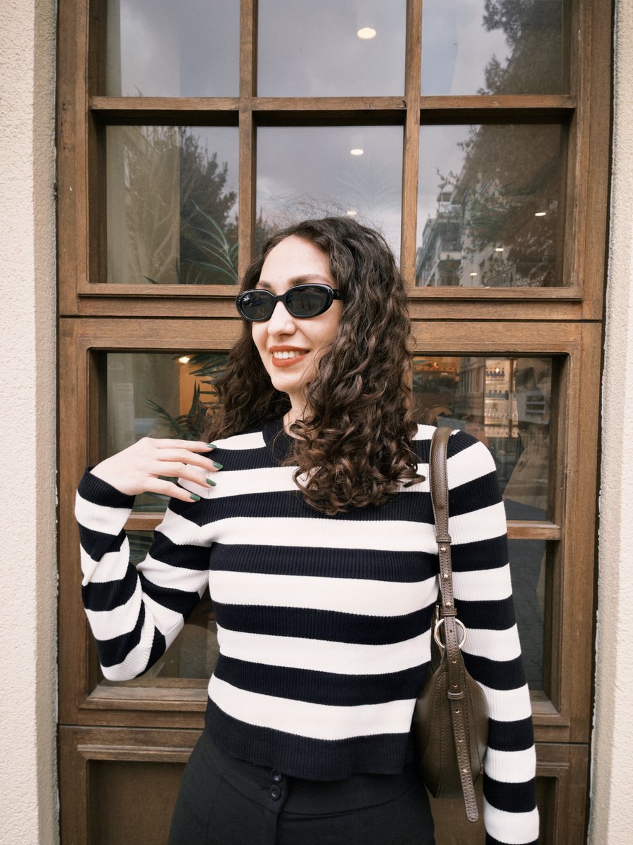 Turn this photo into a Vogue-style fashion illustration, preserving identity