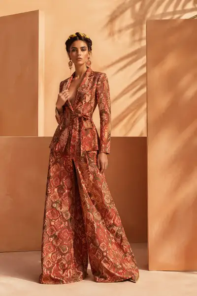 High-fashion editorial in patterned red suit