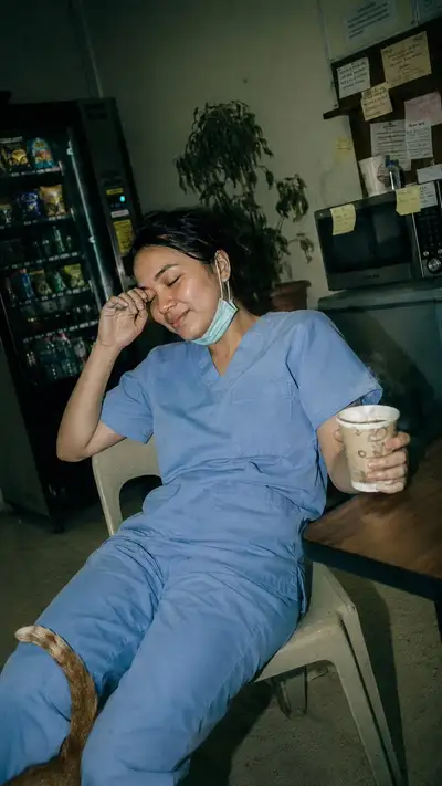 Exhausted Nurse in 2004 Break Room Photo