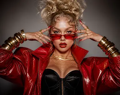Femme-fatale red patent leather editorial portrait