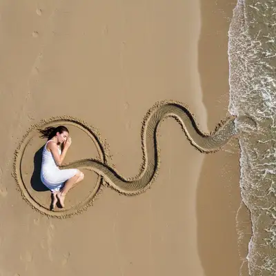 Land-art beach photography with a hand-dug water channel