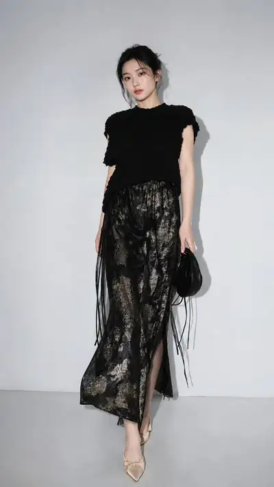 Full-Body Studio Fashion Editorial in Black and Sheer Skirt