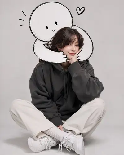Minimalist studio portrait with a cartoon doodle hug