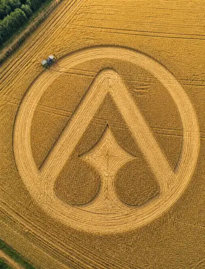 Aerial crop-art photo of a logo cut into a wheat field