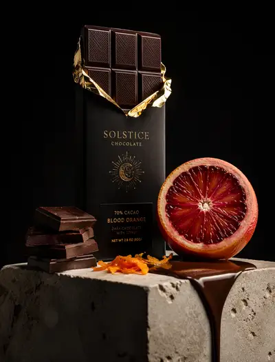 Dark chocolate bar with blood orange product photography