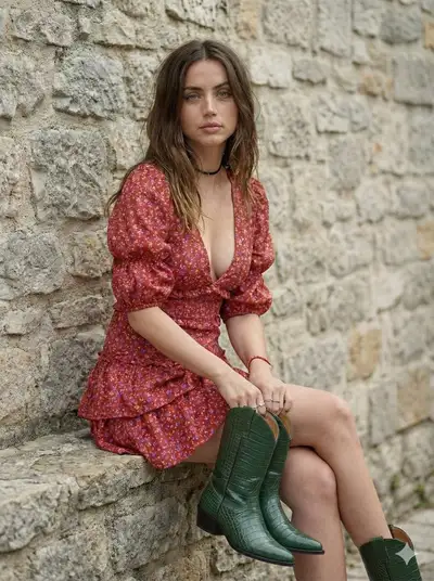 Bohemian cottagecore portrait leaning against a stone wall