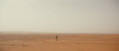 Solitary Astronaut in Vast Martian Landscape