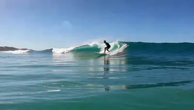 Surfer Carving Turquoise Wave