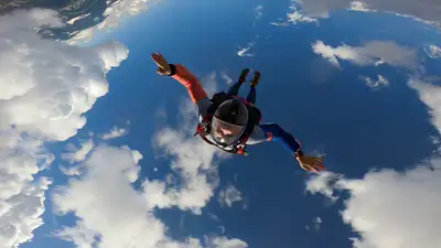 Skydiver POV Through Clouds