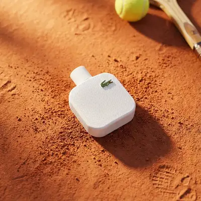 Top-down luxury product photo on a textured surface