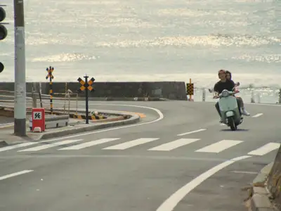 Coastal scooter ride vintage-film video prompt for Seedance 2.0