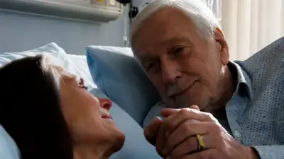 Emotional Hospital Bed Scene with Aging Man and Wife