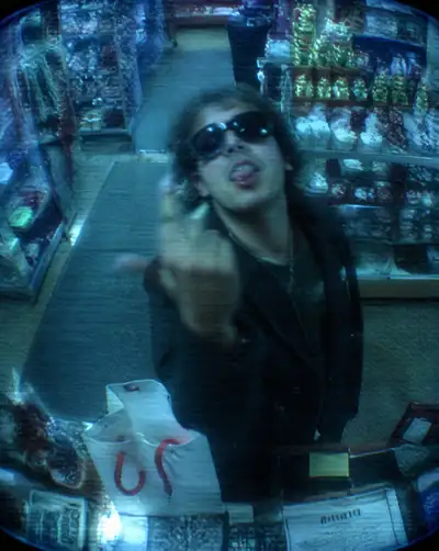 Gritty CCTV style surveillance photo of a defiant shopper