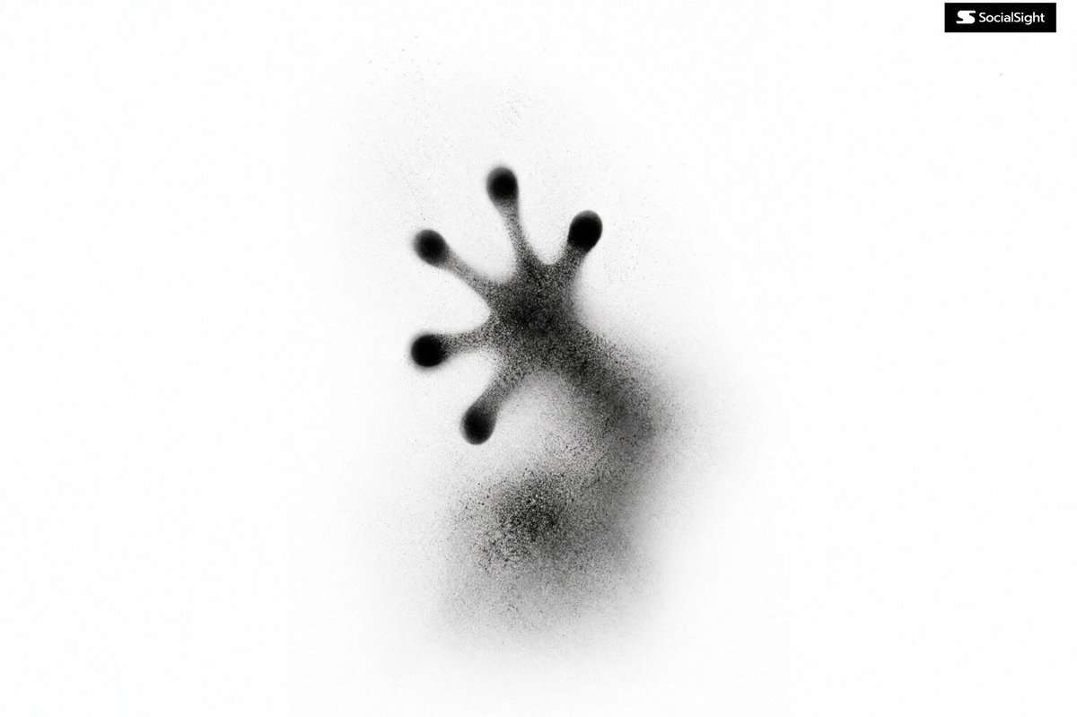 Dissolving black spray-particle silhouette (templated)
