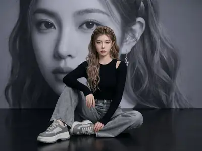 Editorial Fashion Portrait With a Giant Face Mural Backdrop