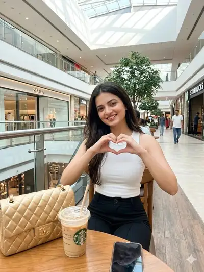 Young woman with Chanel bag in mall