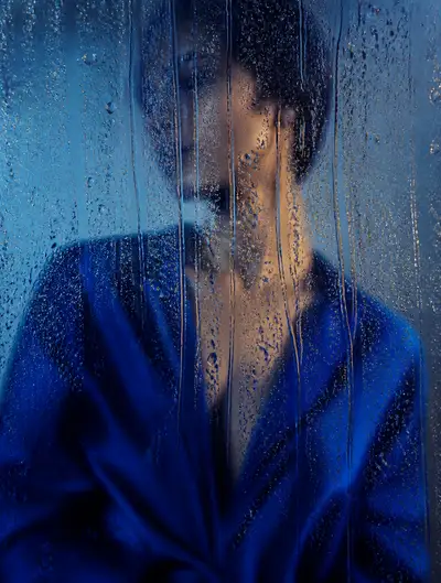 Rain-streaked glass fashion portrait prompt
