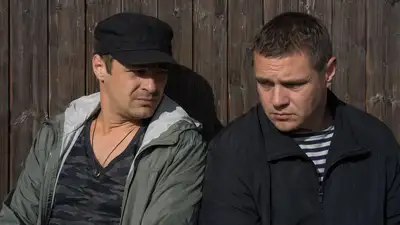 Detailed camera and lighting breakdown of two seated men