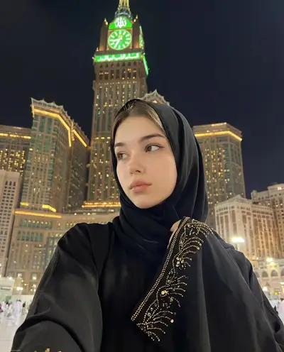 Spiritual night selfie at Makkah Royal Clock Tower with identity lock