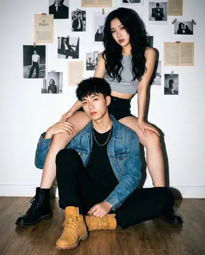Edgy Asian couple streetwear portrait with flash lighting