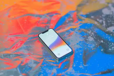 iPhone 15 Mockup on Metallic Bubble Wrap