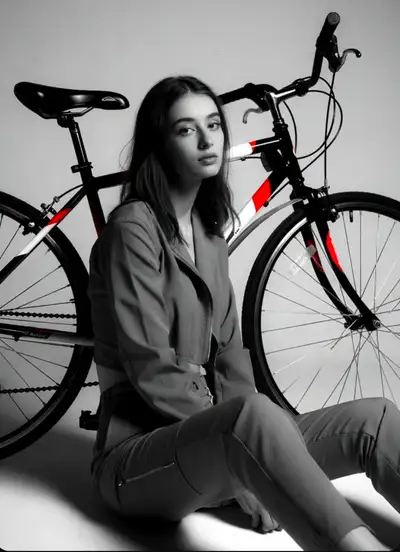 Studio Portrait with Bicycle in Black and White with Red Accents