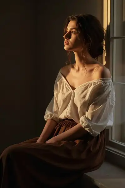 Classic Editorial Portrait of a Woman Gazing Out a Window