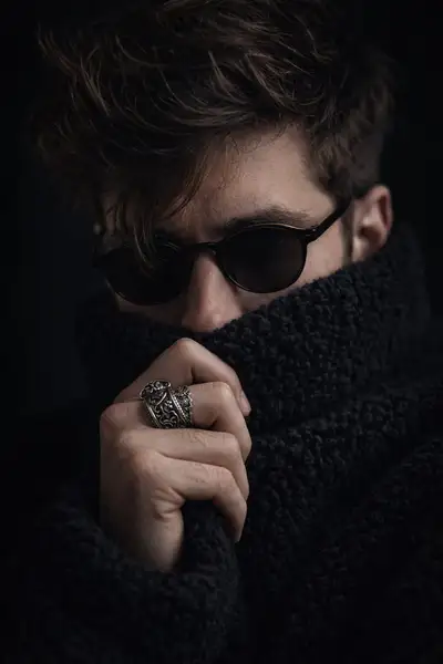 Moody close-up portrait of a man in a teddy-fleece sweater