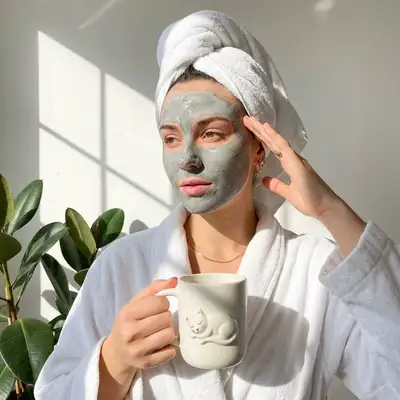 Morning self-care routine portrait with clay mask