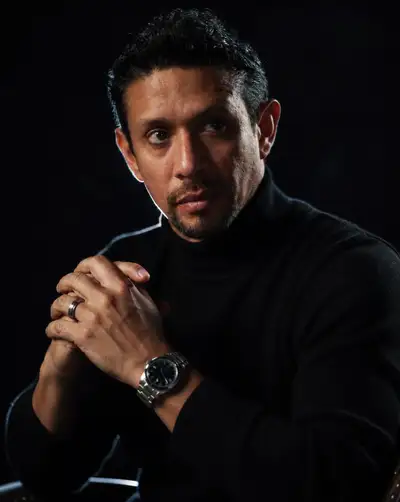 Moody night-mode portrait of a man in a turtleneck