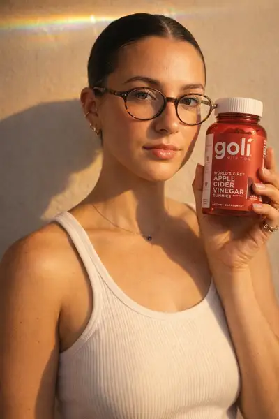 Golden hour portrait holding product with reference face match