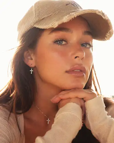 High key backlit portrait with baseball cap