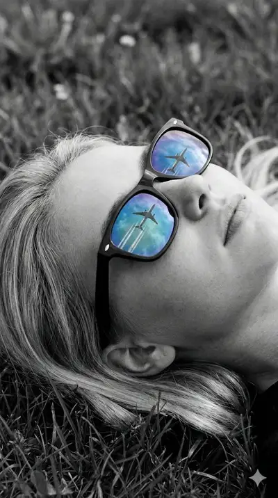 Cinematic Close-Up: Woman with Sky Reflection in Glasses
