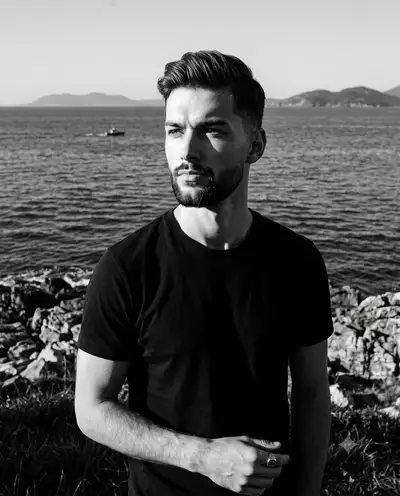 High-contrast monochrome coastal male portrait