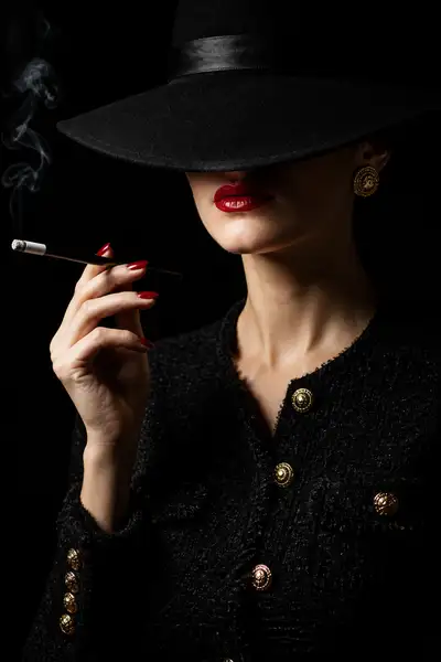 Vintage noir portrait with cigarette holder and tweed