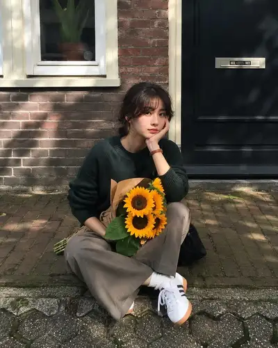 European sidewalk lifestyle portrait with sunflowers